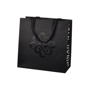 Buy cheap Customized UV Coating Paper Packaging Bags With Flat Cotton Handle from wholesalers