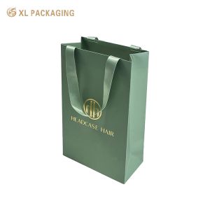 China XL Packaging Custom Packaging Factory Custom Design Printed Shopping Gift Packaging Paper Bag With Your Own Logo Luxury Green Ribbon Thick Paper Bag For Clothes on sale