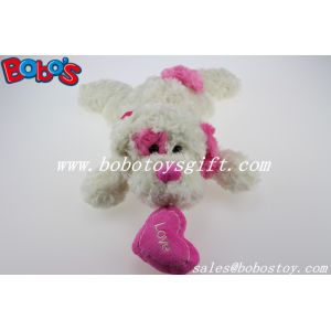 Buy cheap China Factory Made Plush White Lying Baby Dog Toy With Pink Heart Pillow from wholesalers