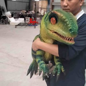 Buy cheap Cutest popular customizable large simulation waterproof Animatronic Dinosaur baby toy in hands for Theme Park from wholesalers