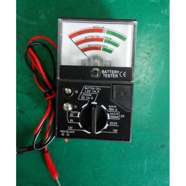 Battery tester front view showing display and battery slots