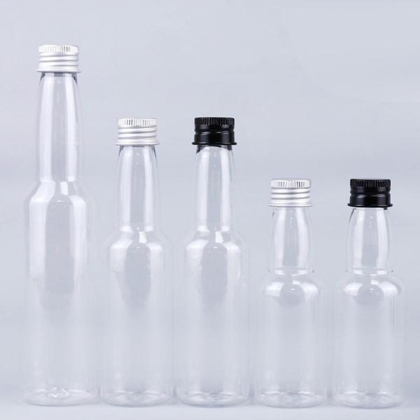 Quality Hot Sale 50ml Transparent Round Plastic PET Spirits Liquor Bottle With Aluminum Cap for sale