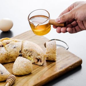 Buy cheap Home Cooking Delicate Wooden Handle Glass Measuring Spoon from wholesalers