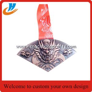 Buy cheap Relief metal medal with raised wolf head, personalized embossed metal medals, from wholesalers