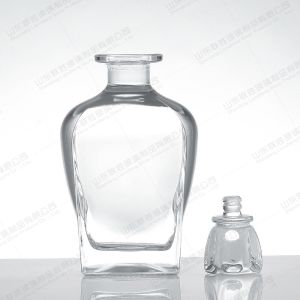 China 750ml Glass Liquor Bottles with Customized Bottle Color and Custom Size in Triangle Shape on sale
