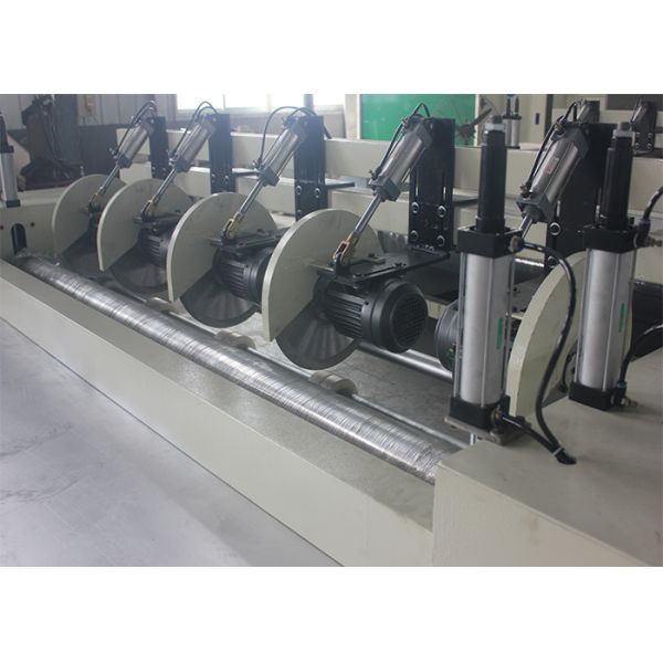 NON-WOVEN ROLLING AND CUTTING MACHINE