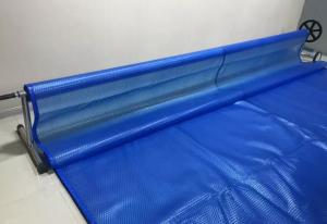 China 9M * 15M Swimming Pool Solar Cover Anti - UV Waterproof Heat Retention Automatic Swimming Pool Cover on sale