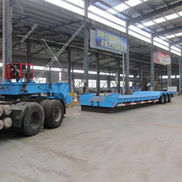 Quality 2180mm Tread Steel 2 Axles Lowbed Semi Trailer with Hydraulic Rear Ladder Competitive for sale