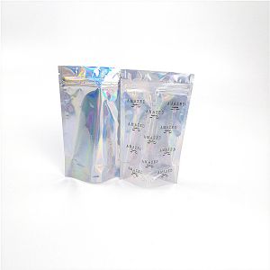 Buy cheap Shinny Glossy Hologram Cosmetic Packaging Bag Biodegradable With Transparent Front from wholesalers