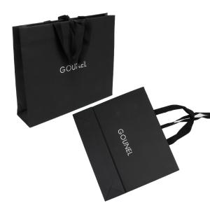 Buy cheap Full Embossing Black Dyed Garment Paper Shopping Bags With Handles from wholesalers
