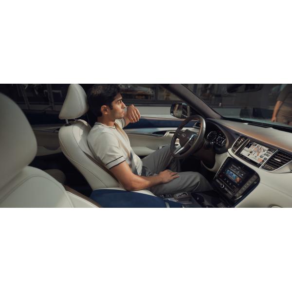 Driver in the 2024 INFINITI QX50 compact SUV
