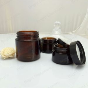 Buy cheap Face cream amber glass jar with black plastic cap from wholesalers