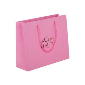 Buy cheap Glossy Lamination Coated Paper Bags Packaging Cosmetic With Handle from wholesalers