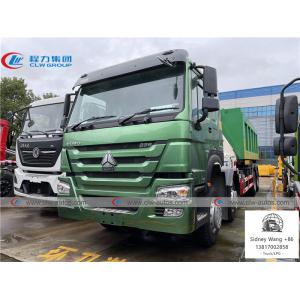 Buy cheap SINOTRUK HOWO 8x4 LHD Hydraulic Hooklift Garbage Truck With Folded Arm Crane from wholesalers