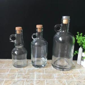 Buy cheap Sturdy Base 750ml Glass Vodka Whiskey Bottle with Handle and Customization Service from wholesalers