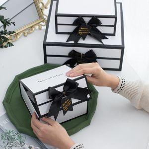 Buy cheap Rigid White Magnetic Cardboard Gift Boxes With Black Rim And Ribbon Bow from wholesalers