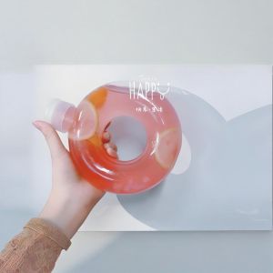 Buy cheap Custom Shape Plastic Juice Bottle 550ml PP Donut Shaped Juice PETG Milk Tea Plastic Bottle with Pull Ring Lid from wholesalers