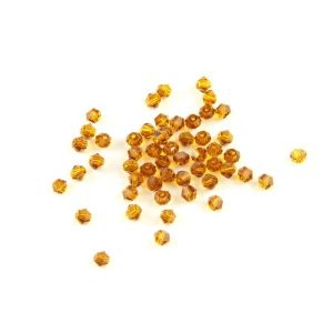 Buy cheap Tea Color Crystal Bicone Beads For Various Purposes product